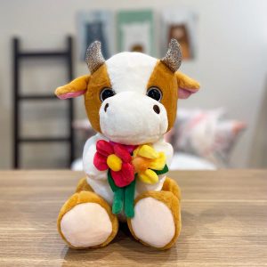 عروسک گاو گل به دست